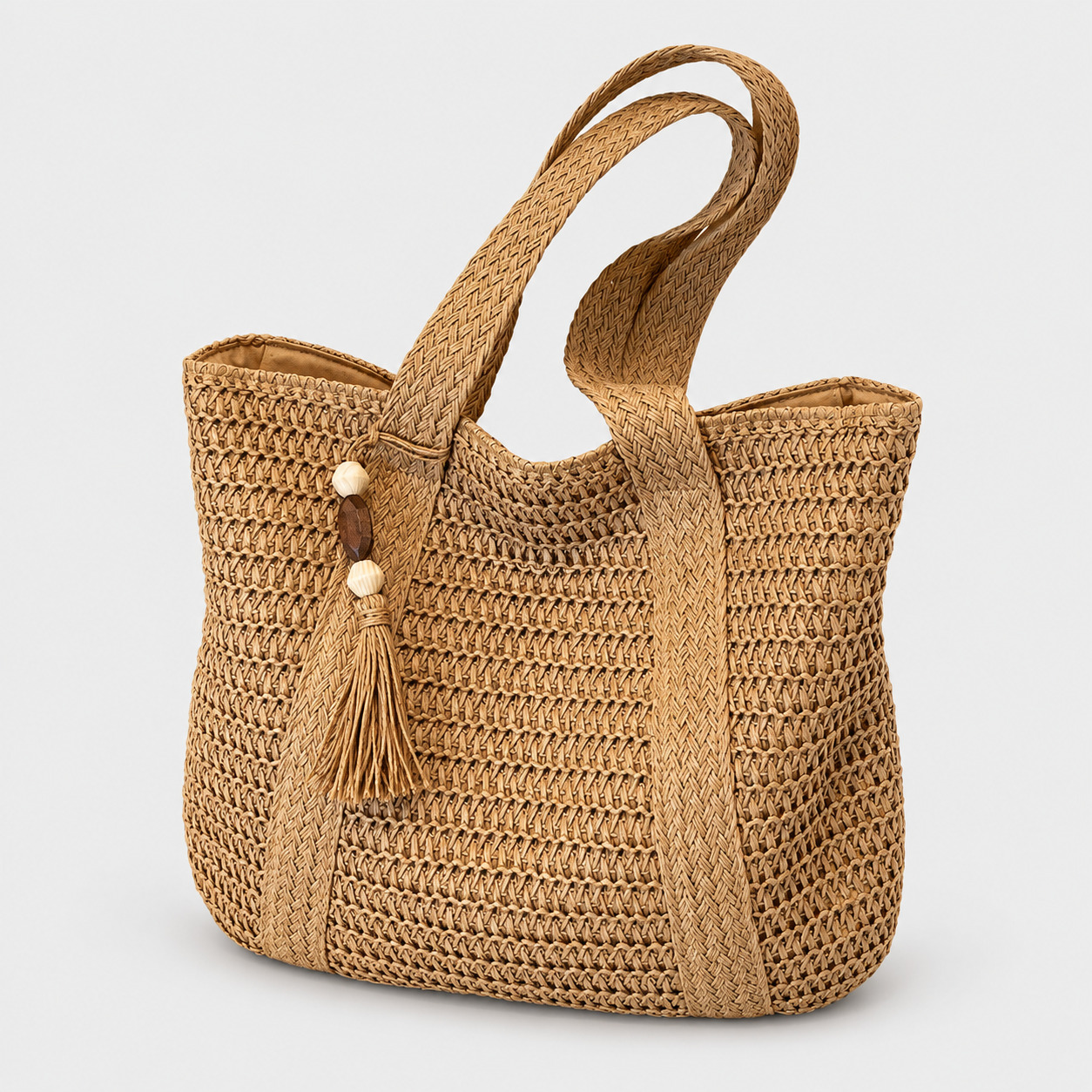 Sac En Paille Tressée Bandoulière – Paolita Sac en paille tressée bandoulière Paolita couleur naturelle avec pompon et perles décoratives